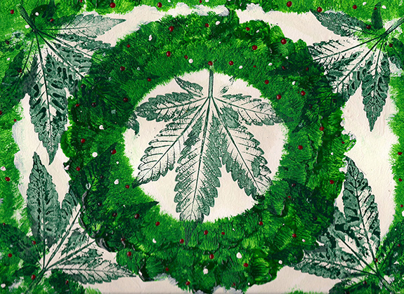 A piece of graphic art has green stamped cannabis leaves alongside and on top of a bright evergreen wreath in the middle of the frame. There are very small white and red berries adorning the wreath.